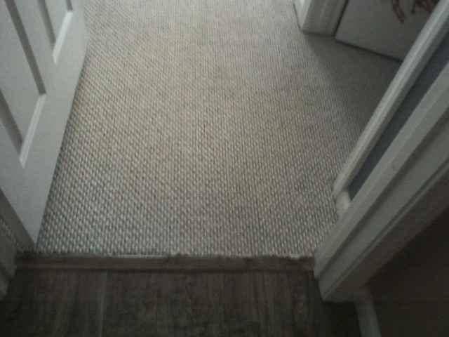 picture of a white hallway carpet after being cleaned